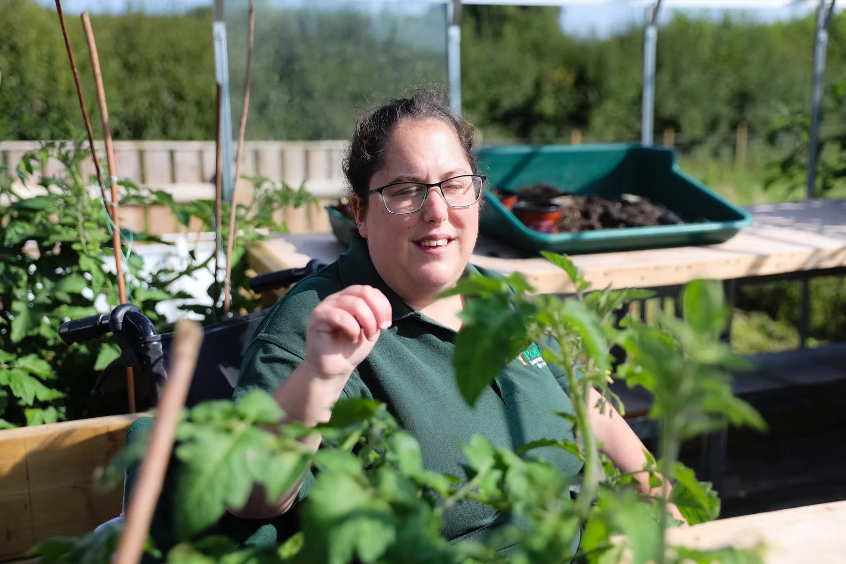 Imagery of a Living Potential member working in the allotment